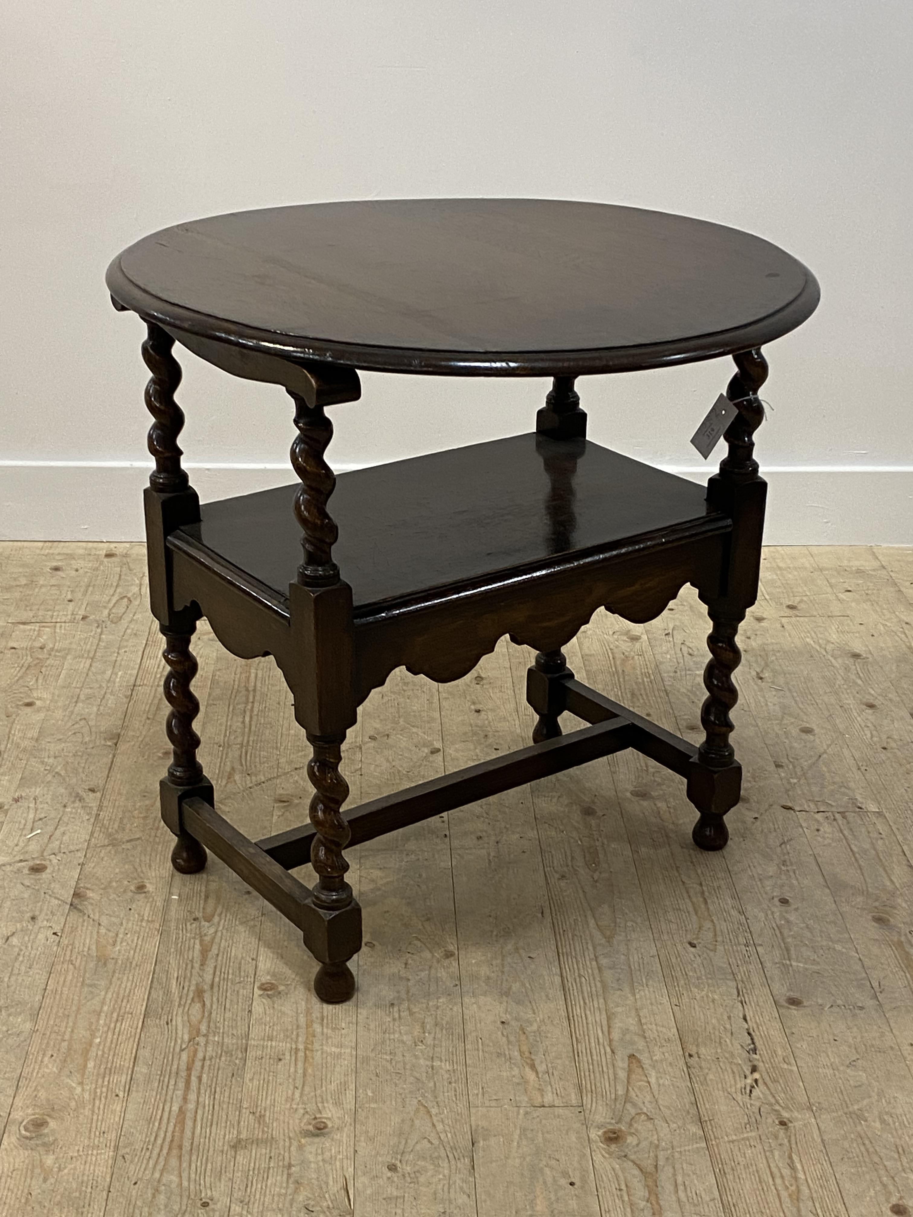 An oak monk's bench of 18th century design, the lozenge carved circular back rest over spiral turned - Image 2 of 2