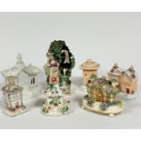 An early 19thc Pratt ware figure group of a courting couple, back a/f, lady holding a sheet of