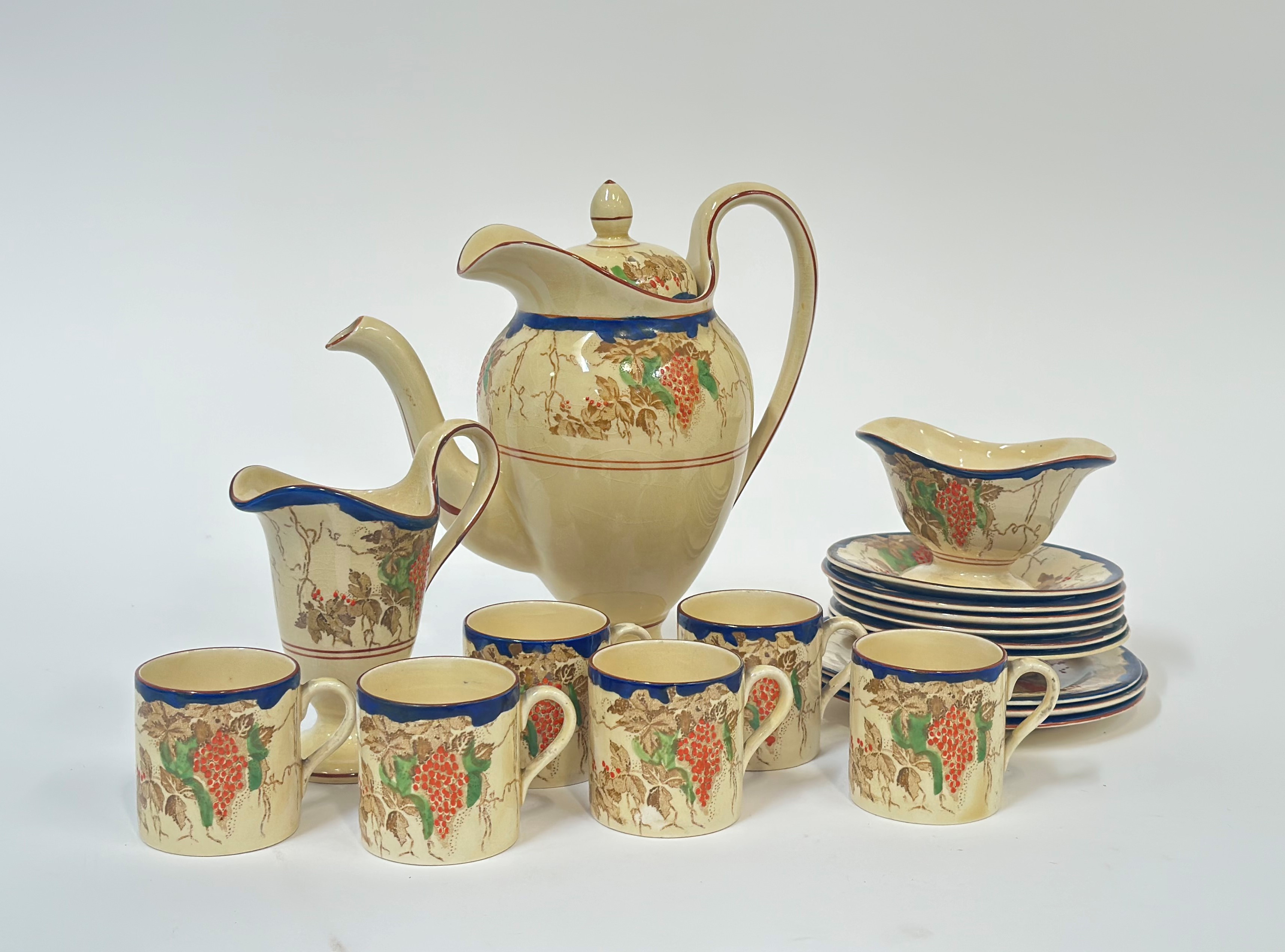 A near complete 1930's Bursley ware Bacchus pattern coffee service comprising, six coffee cans, a