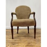 A 19th century mahogany open armchair, possibly Irish, the back seat and open arms upholstered in