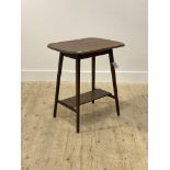 An Edwardian oak side table, the moulded top raised on square tapered supports united by an under
