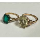 A 9ct gold ring set green cushion cut stone, table badly scratched and worn, mounted in