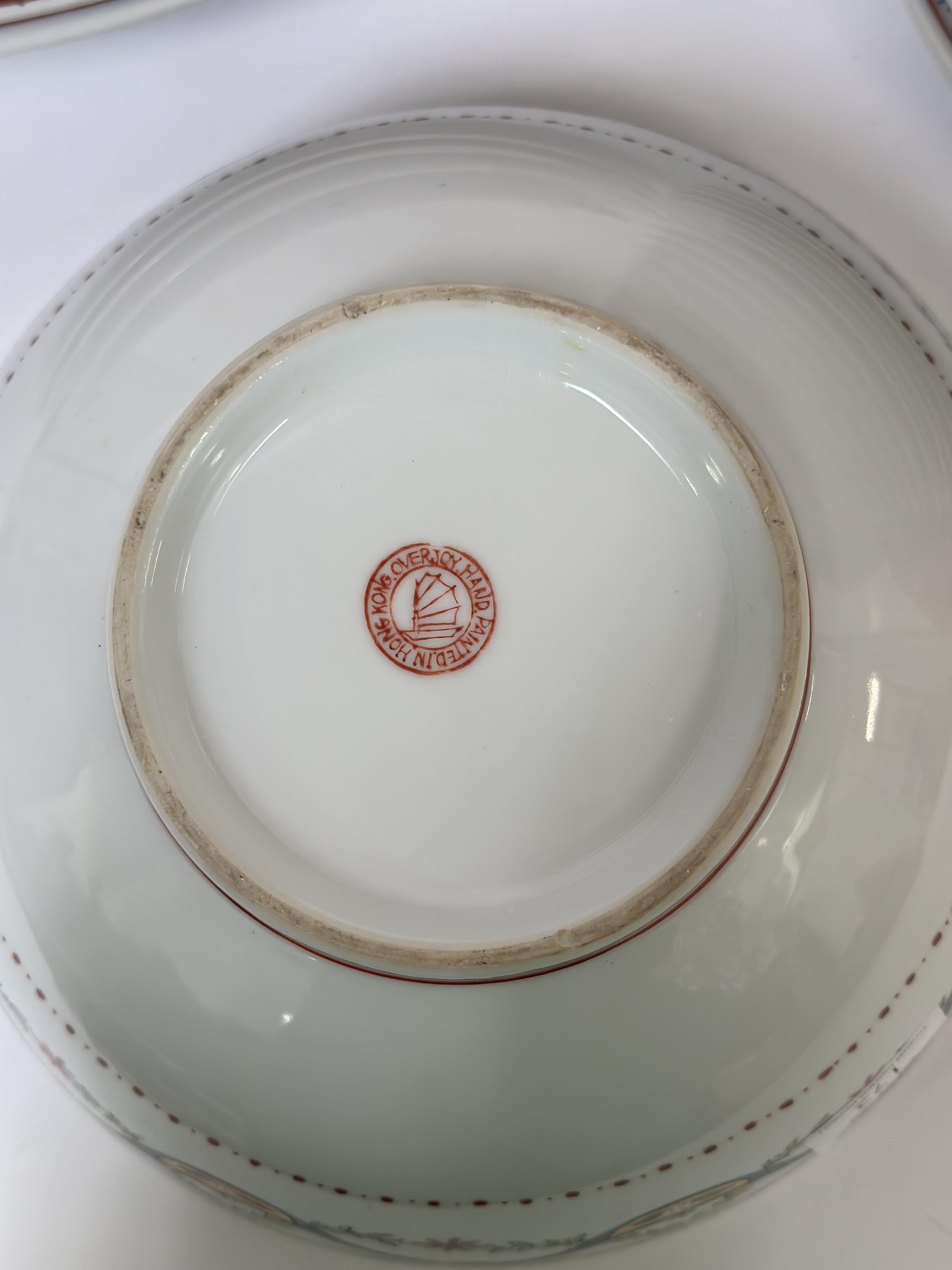 A Chinese porcelain part dinner service with polychrome decoration of floral swags and gilding - Image 2 of 2