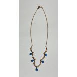 A 9ct gold chain trace link necklace double hoops, mounted with five pear shaped turquoise drops, (