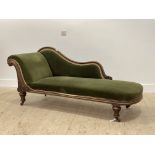 A Victorian walnut framed chaise longue, the serpentine show frame over seat and back upholstered in