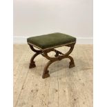 A William IV rosewood stool, the seat upholstered in green velvet, raised on two acanthus leaf and