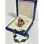 C F Piguet & Son Troy Johannesburg 9ct gold 1970s bronzed and white anodised 9ct gold brooch, set
