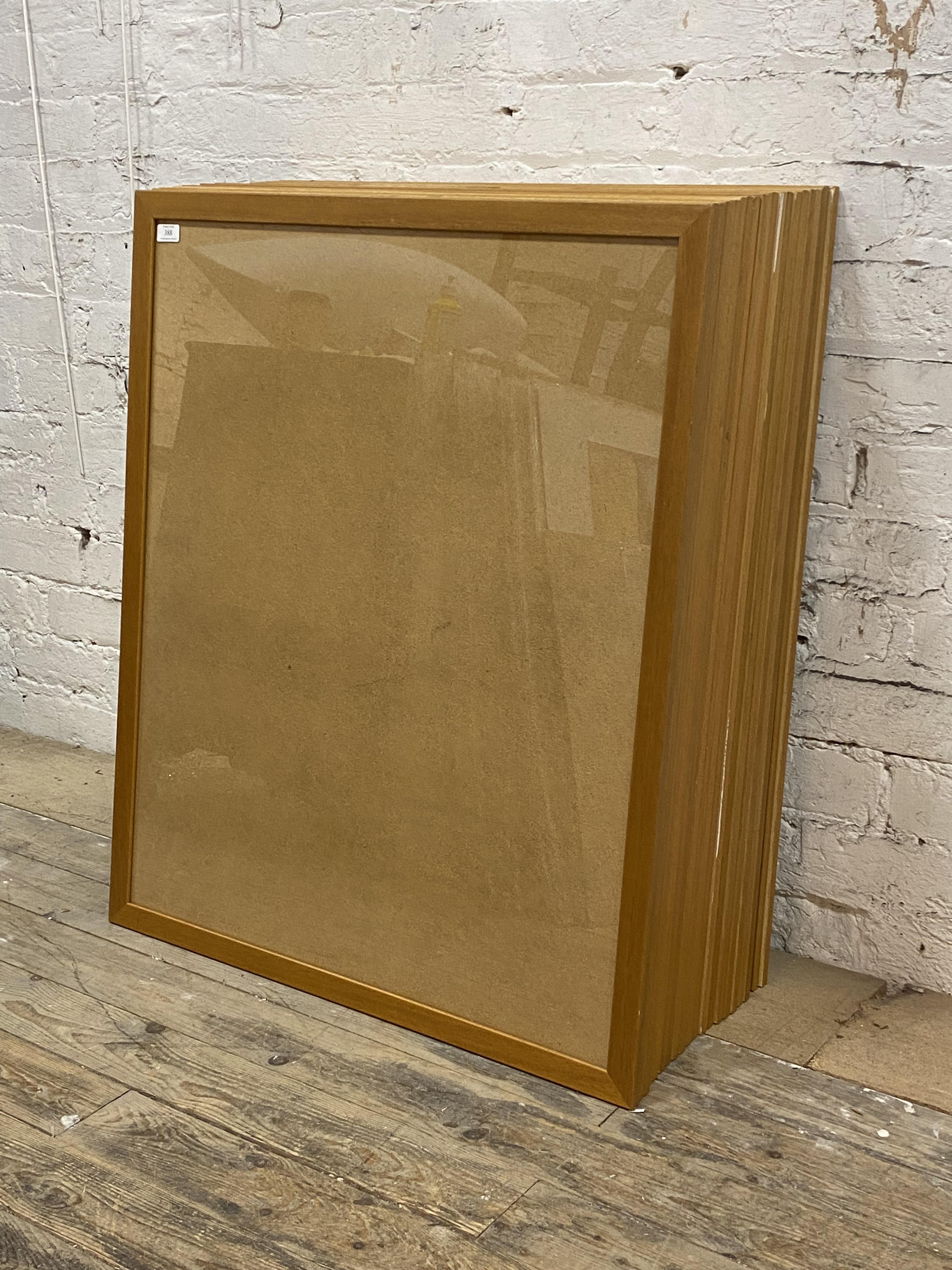 A group of twenty art glass glazed hardwood picture frames, each complete with backing 84cm x 100cm