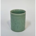 A Chinese celadon porcelain brush pot with design of dragons and pearl, the borders decorated with