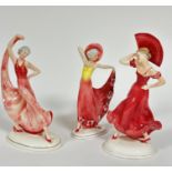 A Katzhutte group of three porcelain Art Deco figures of ladies, one holding the hem of her dress