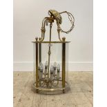 A gilt lacquered brass cylindrical hall lantern, with glazed sides, six branches, complete with