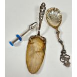 A Th. Marthinsan sterling Norwegian silver rococo style serving spoon with C scroll and shell scroll