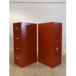 A pair of Bisley red painted pressed aluminium four drawer filing cabinets, H132cm, W47cm, D63cm
