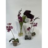 A group of artificial decorative flowers comprising a glass vase with purple tulips (h- 56cm), and