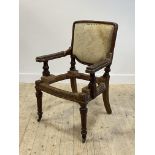 Lamb of Manchester, a 19th century oak framed armchair, the back seat and open arms over turned,