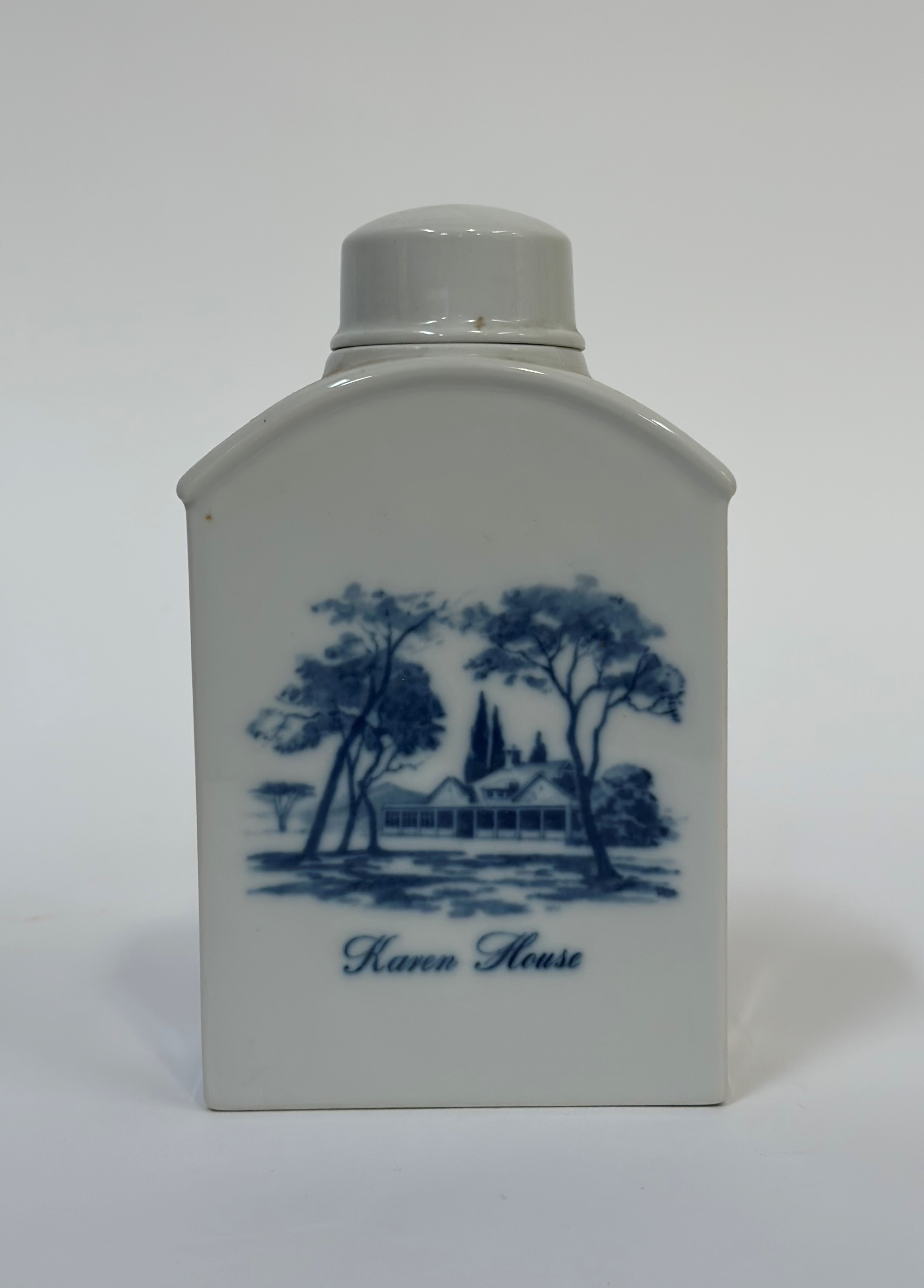 Royal Copenhagen, a blue and white tea caddy depicting a man and dog and a rural scene labelled '