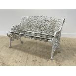 A Victorian style white painted aluminium garden bench, the back rest in the form of trailing