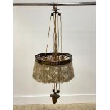 An Arts and Crafts period brass rise and fall light ceiling pendent light fitting, complete with