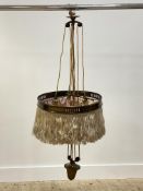An Arts and Crafts period brass rise and fall light ceiling pendent light fitting, complete with