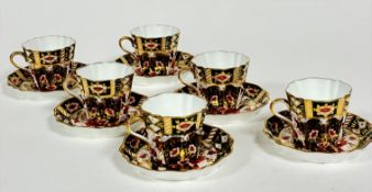A set of six Wedgwood 1900-1930 green Imari style decorated fluted tea cups with matching saucers,