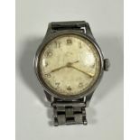 A gentleman's vintage stainless steel wristwatch with manual movement and silvered dial, with gilt