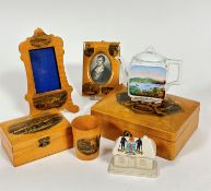 A mauchline ware satinwood rococo style photograph frame with Dunstaffage Castle, Oban, and Oban