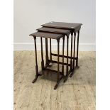An Edwardian mahogany nest of three tables, rectangular moulded top over ring turned sledge supports