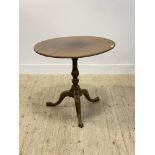 A George III mahogany tripod table, circular snap top (a/f) raised on ring turned column and