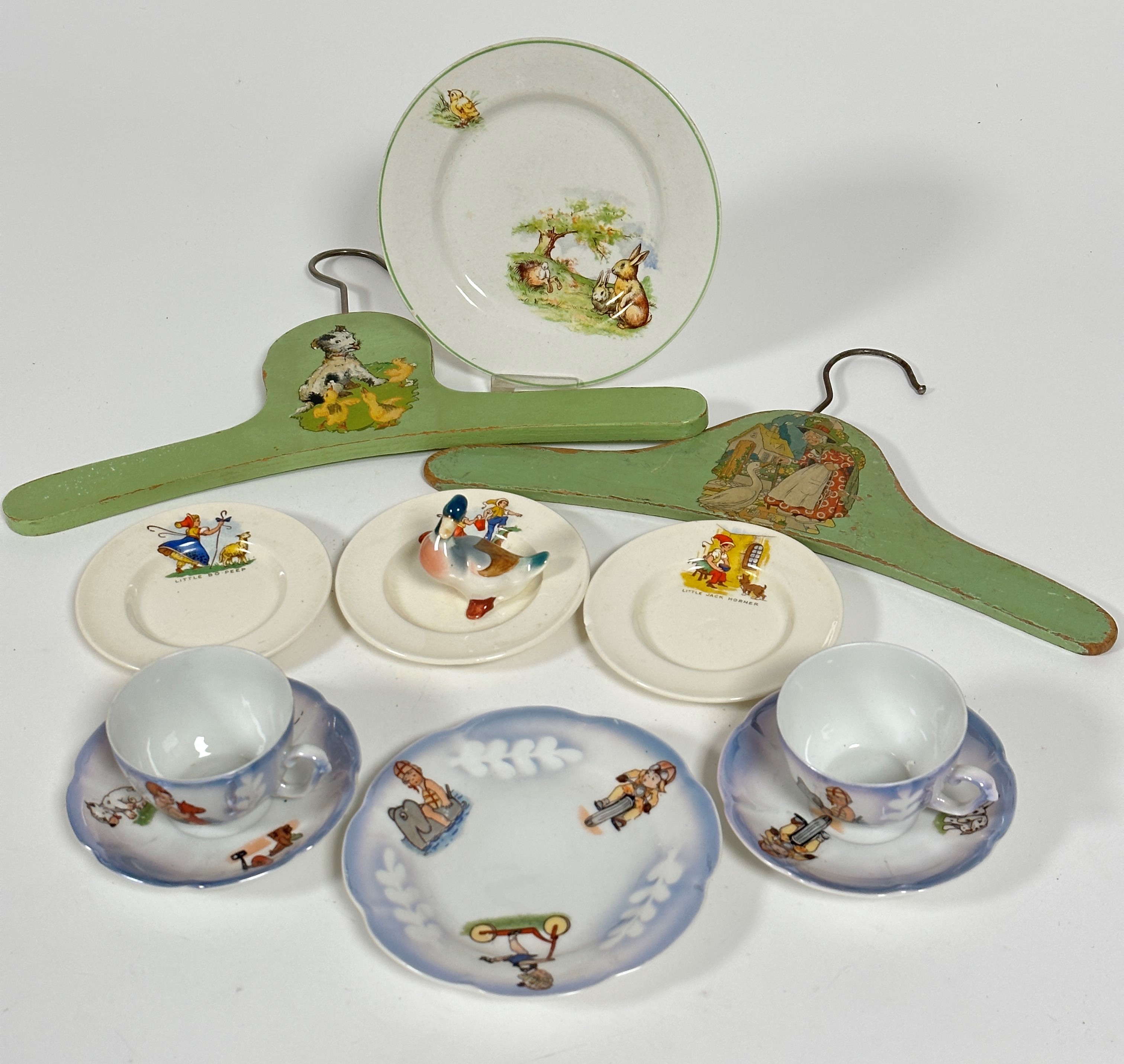 A set of three 1920s children's teaset saucers, decorated with Jack and Jill, Little Bo Peep, Little