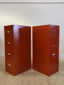 A pair of Bisley red painted pressed aluminium four drawer filing cabinets, H132cm, W47cm, D63cm