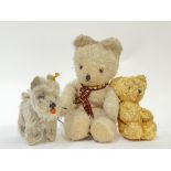 A group of vintage stuffed animals comprising a large white Bear with red/gold scarf (h- 28cm), a