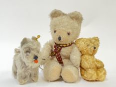 A group of vintage stuffed animals comprising a large white Bear with red/gold scarf (h- 28cm), a