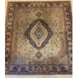 A Persian style machine woven carpet, mid 20th century, the ivory field with blue medallion and