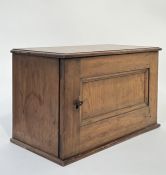 An early 20th century pine letter cabinet with side hinged locking door (and key), the interior with