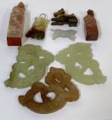 A group of Chinese carved stone items comprising three Jade carvings of mythological creatures (