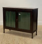 A Regency style mahogany side cabinet, 20th century, twin glazed and silk lined doors enclosing