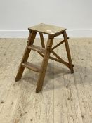 A Vintage pine and beech two rung folding step ladder H56cm