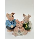 A group of three Wade pottery NatWest piggie banks including 'Lady Hilary', 'Woody', and '