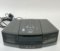 A black Bose Wave radio/CD model AWRC3G with alarm clock function