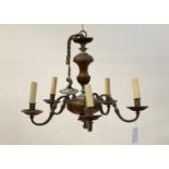 A French style silvered metal, turned walnut and copper five branch chandelier with chain and