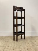 An early 20th century stained oak four tier open bookcase, H95cm, W33cm, D16cm