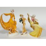 A large Katzhutte standing Figure, Lady in Gold Evening Dress, on oval base (29cm x 12cm x 9cm), a