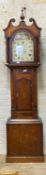 A mid 19th century mahogany and oak longcase clock, the hood with urn final and swan neck pediment
