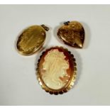 A 9ct gold mounted oval cameo brooch pendant with triple headed portrait shell carved cameo with