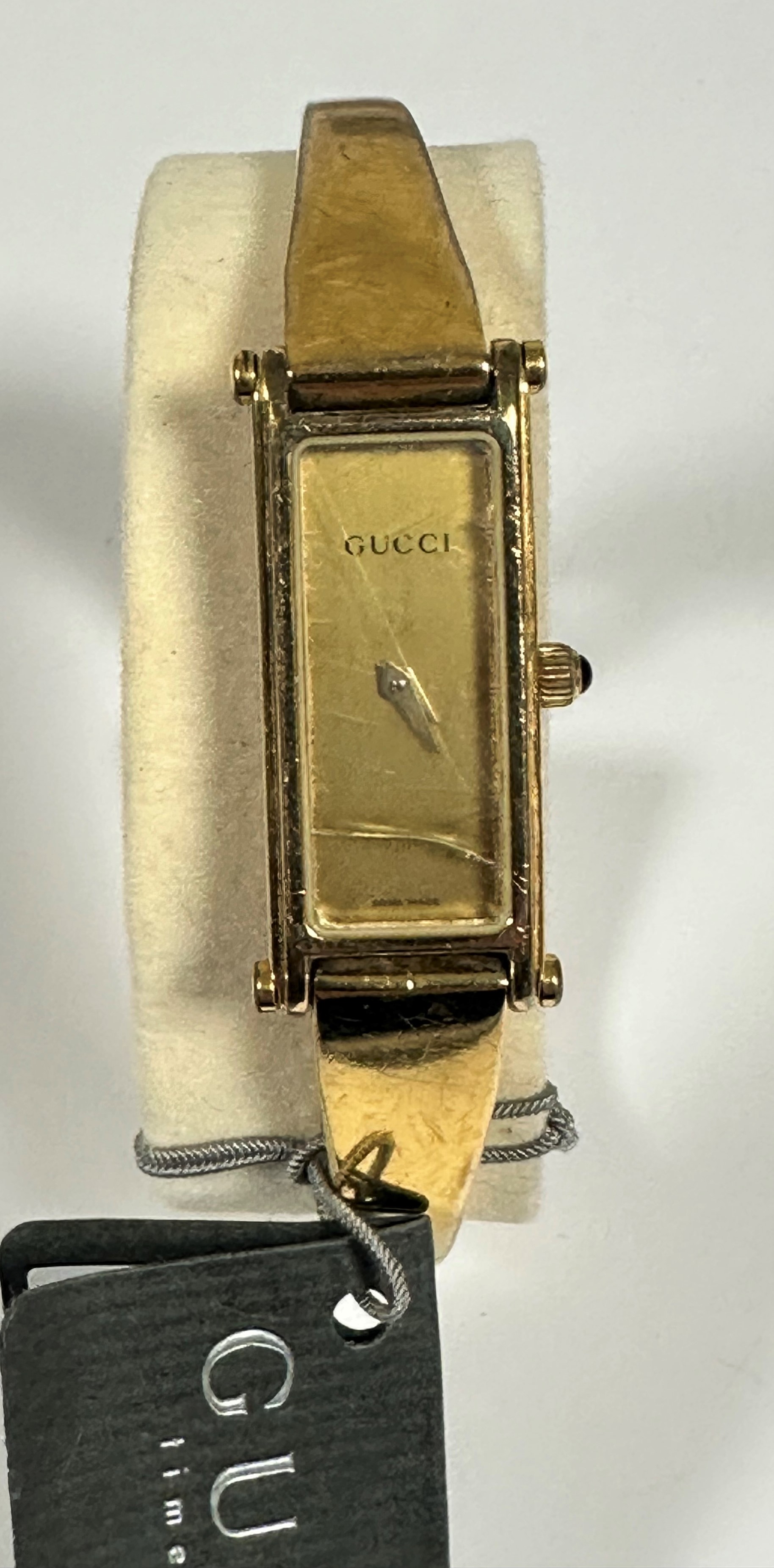 A Gucci gilt on stainless steel lady's quartz wristwatch with rectangular dial on metal stiff bangle - Image 2 of 4
