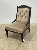 A Victorian ebonised slipper chair, the back and seat upholstered in beige velvet, raised on