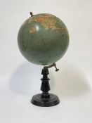 An early 20th century 12" diameter terrestrial globe by W.A & A.K Johnston Ltd, Edinburgh and