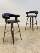 A pair of contemporary bar stools, with faux leather upholstered open back and seat pad, raised on