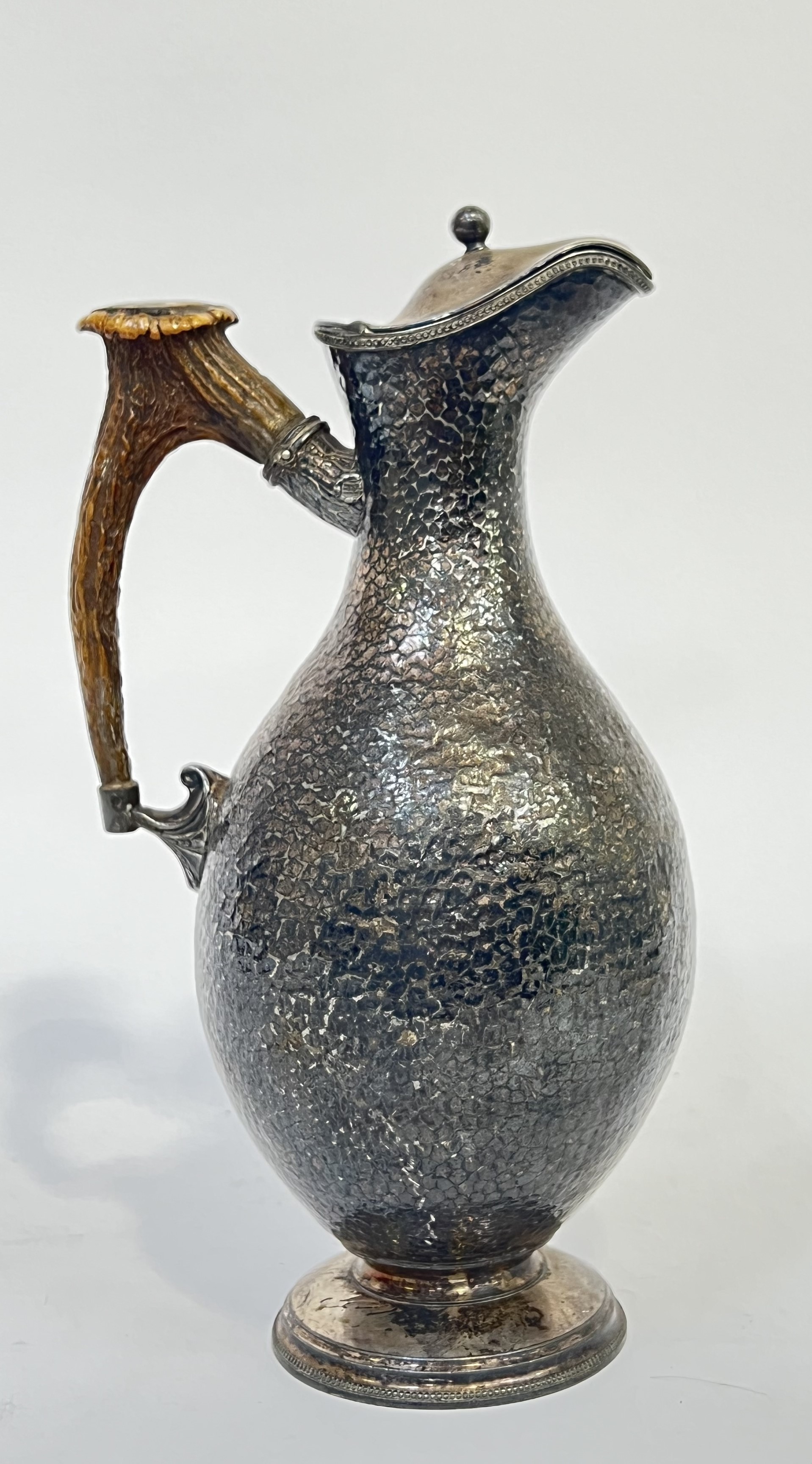 James Dixon & Sons, a sleigh topped Electroplated Britannia Metal planished ewer with stag antler