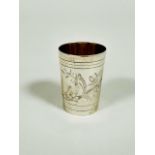 A Russian silver vodka shot glass in the Edwardian style, of tapered cylinder form, with engraved